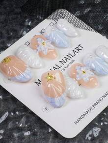 10片手工制作的梦幻蓝色3D花朵杏仁形美甲贴纸，采用3D花朵设计和金色海星装饰，适合女性和女孩日常佩戴、度假和参加派对。这是送给女性和女孩的绝佳礼物。按压式美甲贴纸。 - 彩色 - 查看 4