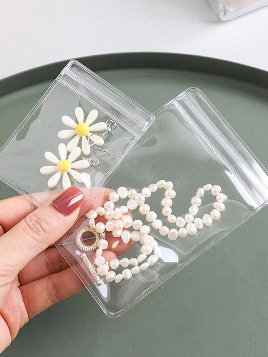 100个/5个装抗氧化首饰收纳袋，可重复密封透明PVC拉链首饰袋，防尘密封袋，适用于戒指、耳环收纳，小巧便捷的首饰整理袋，是收纳首饰、配饰、旅行、礼品、复活节礼物、夏季和返校必备品的理想之选。