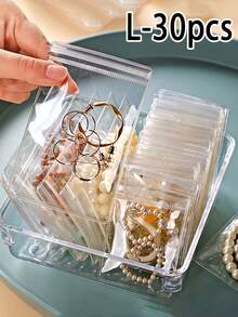 100个/5个装抗氧化首饰收纳袋，可重复密封透明PVC拉链首饰袋，防尘密封袋，适用于戒指、耳环收纳，小巧便捷的首饰整理袋，是收纳首饰、配饰、旅行、礼品、复活节礼物、夏季和返校必备品的理想之选。 - 無色 - 查看 16