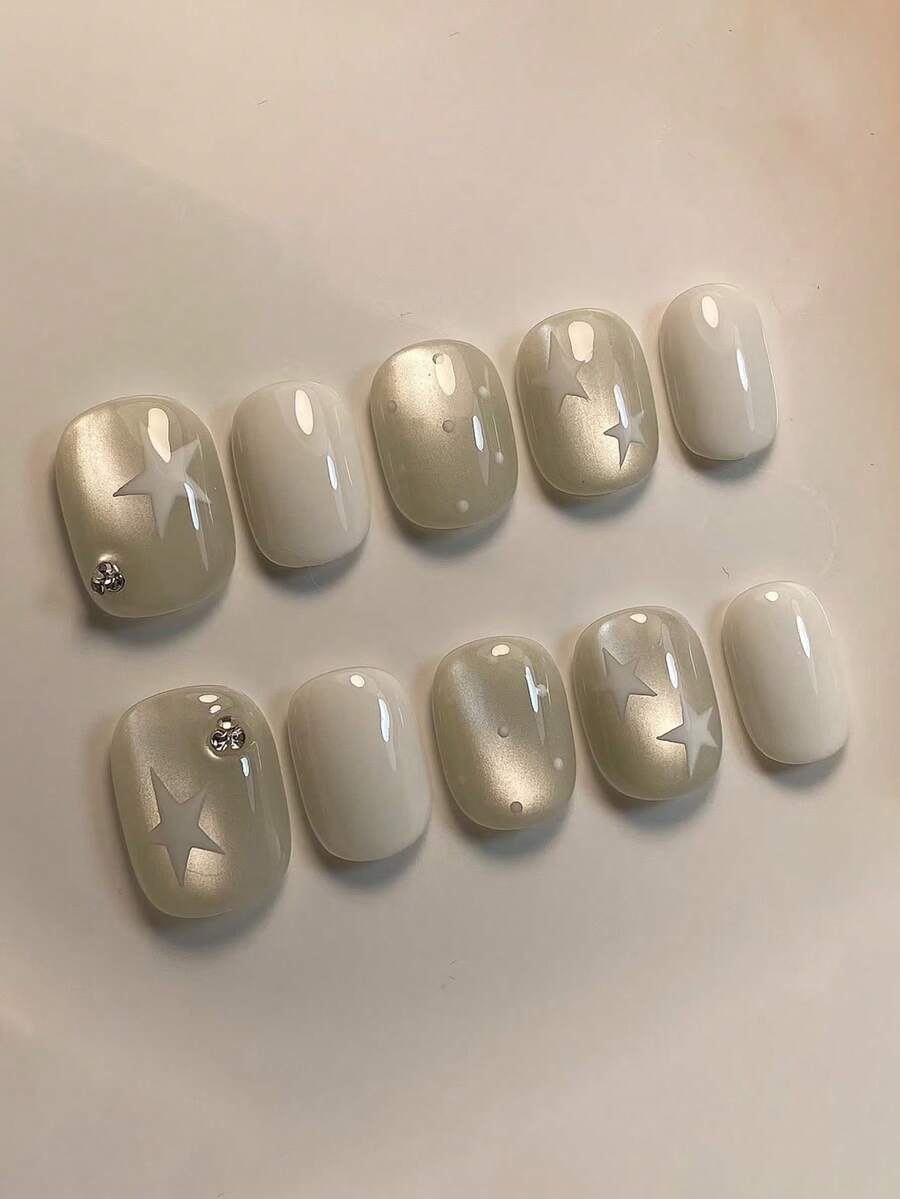 10片手工短橢圓白色美甲貼片,香檳貓眼與手繪星星圖案水鑽裝飾,柔美夢幻風,適合女性與女孩,適用春夏秋冬、派對及日常美甲 - 白色 - 查看 1