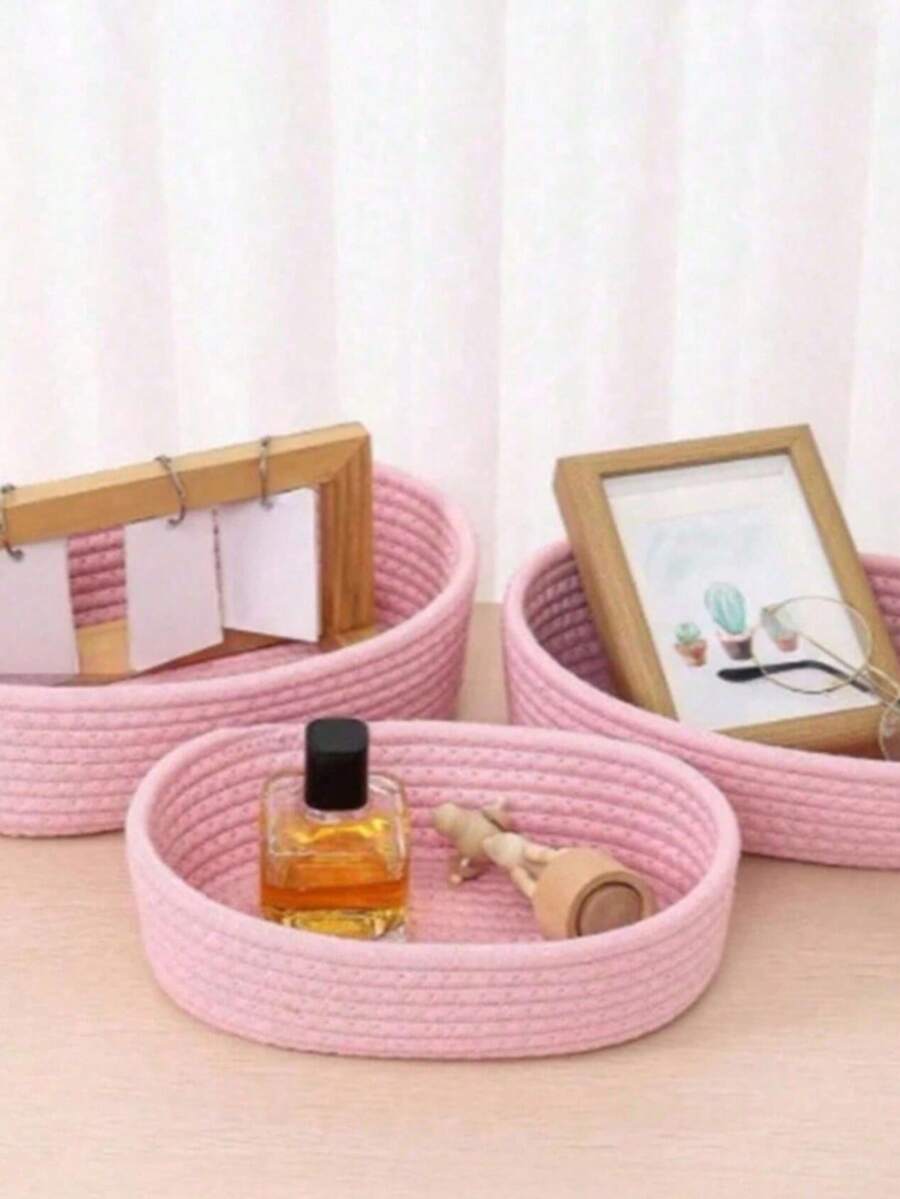Acest coș de depozitare drăguț, roz, în formă de ovală, din bumbac țesut, este perfect pentru depozitarea gustărilor, jucăriilor și cosmeticelor. Potrivit pentru birouri, măsuțe de cafea și holuri de intrare, excelent pentru depozitarea obiectelor mici și a altor bunuri. Aplicabil pentru sufragerie, dormitor și utilizare în exterior. - Baby Pink - Vizualizare 1