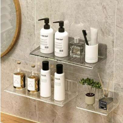 1 chiếc kệ phòng tắm gắn tường có giác hút, thích hợp để đựng đồ trang điểm và mỹ phẩm trong phòng tắm.