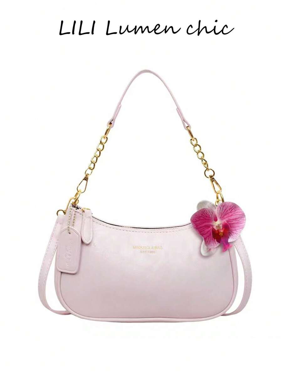 这款全新时尚多功能单肩包/月牙形包/腋下包采用纯色PU材质，并饰有字母图案，非常适合购物。包身点缀着红色人造花，使其成为夏季、海滩度假和开学季的理想之选。它也可以用作女士钱包。 - 粉色 - 查看 1