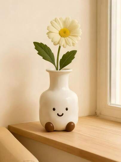 1 chậu hoa hình mặt cười. Một chậu hoa hình mặt cười hoạt hình màu trắng dễ thương, hoàn hảo để trang trí bàn cà phê phòng khách, kệ sách và các không gian trong nhà khác.