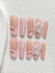 10件套甜美芭蕾风手工美甲套装，包含凝胶美甲套装、蝴蝶结装饰、小珍珠美甲饰品、手工五瓣花美甲贴、粉色指甲油，清新纯净风格，附赠美甲工具（1张果冻贴+1把指甲锉）。提供三种尺寸，适合杏仁形、鸭嘴形和棺材形指甲。适合派对、日常佩戴、聚会、拍照、春夏通勤等场合。 - 彩色 - 查看 19