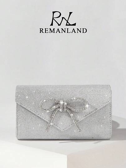 REMANLAND Light Luxury And Glamorous Silver Clutch With Glitter Texture And Crystal Bow Embellishment, Highlighting A Delicate Crystal Bow Design, Sparkling Glitter Finish And Timeless Envelope Shape. A Stylish Companion For Cocktail Parties, Social Soirees And Celebrations, Exuding Sophistication And Grace. It Is The Best Gift For Women