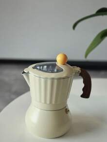Ấm pha cà phê Moka thân trắng sữa, mái vòm vàng, nắp trong suốt, kiểu dáng Ý, nhỏ gọn và dễ thương, phù hợp với bếp ga hoặc bếp từ, rất thích hợp làm quà tặng. - Màu be - Xem 6