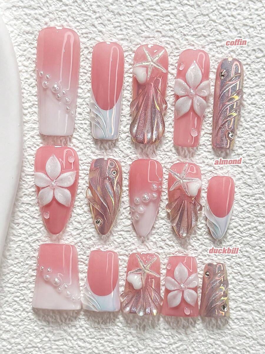 10件套蜜桃粉色浮雕手工美甲套装，包含3D爱心、海星、五瓣花、贝壳纹理凝胶美甲装饰，白色指甲油，适合春夏派对、日常佩戴、拍照等场合，附赠1张美甲贴纸和1把指甲锉，提供杏仁形、鸭嘴形、棺材形三种指甲尺寸可选。 - 彩色 - 查看 1
