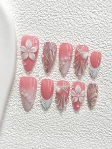 10件套蜜桃粉色浮雕手工美甲套装，包含3D爱心、海星、五瓣花、贝壳纹理凝胶美甲装饰，白色指甲油，适合春夏派对、日常佩戴、拍照等场合，附赠1张美甲贴纸和1把指甲锉，提供杏仁形、鸭嘴形、棺材形三种指甲尺寸可选。 - 彩色 - 查看 12