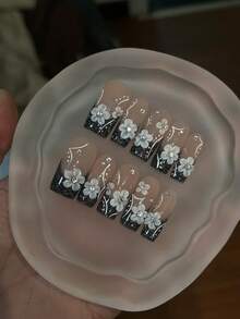10 móng tay giả thủ công nguyên chất, móng dài hình quan tài, màu đen trắng, móng mắt mèo với hoa 3D, dễ thương, sang trọng, hiệu ứng ánh sáng Y2K nhẹ nhàng, cá tính, phù hợp cho nữ và nữ, dùng cho mùa xuân, hè, thu đông, ngày lễ và sinh hoạt hàng ngày. - Đen và trắng - Xem 3