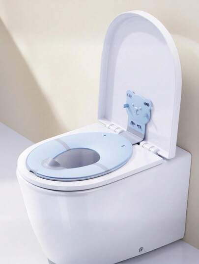 1个卡通可折叠儿童马桶座圈/婴儿如厕训练马桶座圈/便携式可折叠马桶座圈，材质：PP。带吸盘，滑动式吸盘设计，方便收纳。适用于市面上大多数马桶。边缘采用TPR软橡胶材质，防滑性能强。折叠部分加装软橡胶垫，防止夹伤宝宝臀部。包含尿液收集盘（适用于6个月至3岁的婴幼儿）。