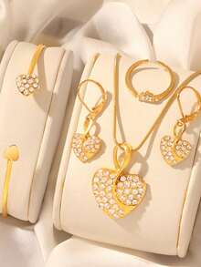 Bộ trang sức cao cấp 6 món hình trái tim đính đá lấp lánh dành cho nữ, bao gồm đồng hồ đeo tay đa chức năng, vòng tay vàng hình trái tim, bông tai, dây chuyền và nhẫn, mang phong cách lấp lánh và sang trọng, toát lên vẻ tinh tế. - Vàng - Xem 6