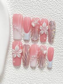 10件套蜜桃粉色浮雕手工美甲套装，包含3D爱心、海星、五瓣花、贝壳纹理凝胶美甲装饰，白色指甲油，适合春夏派对、日常佩戴、拍照等场合，附赠1张美甲贴纸和1把指甲锉，提供杏仁形、鸭嘴形、棺材形三种指甲尺寸可选。 - 彩色 - 查看 4