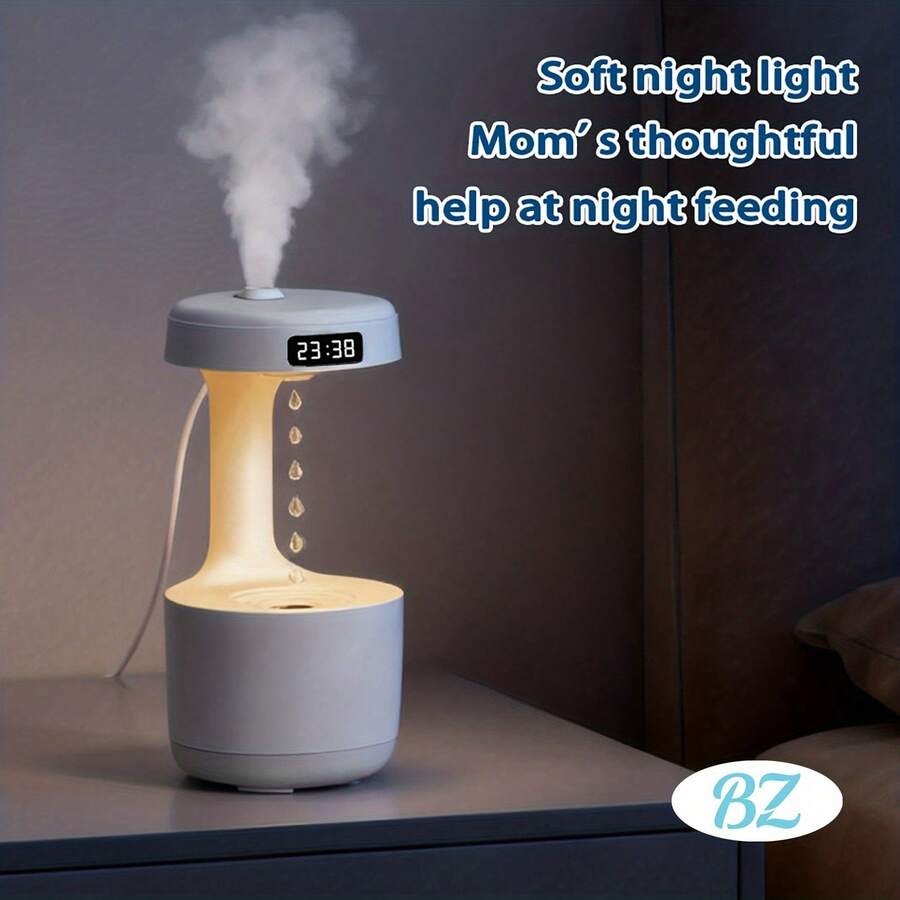 Este humidificador para el hogar, diseñado para reponer el agua y con un rociado visual creativo que se asemeja a gotas de agua, viene con una pantalla que muestra la hora y tiene una función de luz cálida. Es un regalo perfecto para ocasiones como la Navidad.
