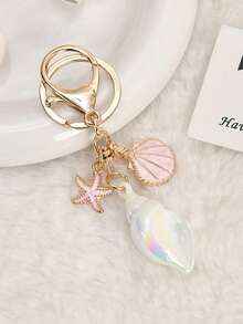 1个全新海洋风贝壳海星钥匙扣，合金+彩色亚克力材质，蓝白两色可选。贝壳、海星和龙虾扣三件套设计，可爱又少女心。可挂在包包、钥匙、背包上，增添夏日度假氛围。适合学生和甜美女孩，日常出行、海滩旅行皆宜，也是夏季、生日等场合的贴心礼物。 - 彩色 - 查看 7