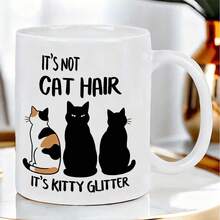 可爱有趣的猫咪剪影陶瓷马克杯，印有幽默的“这不是猫毛，这是猫咪闪粉”字样，造型自然逼真，双面清晰印刷，经久耐用，适合日常使用。 - 彩色 - 查看 1
