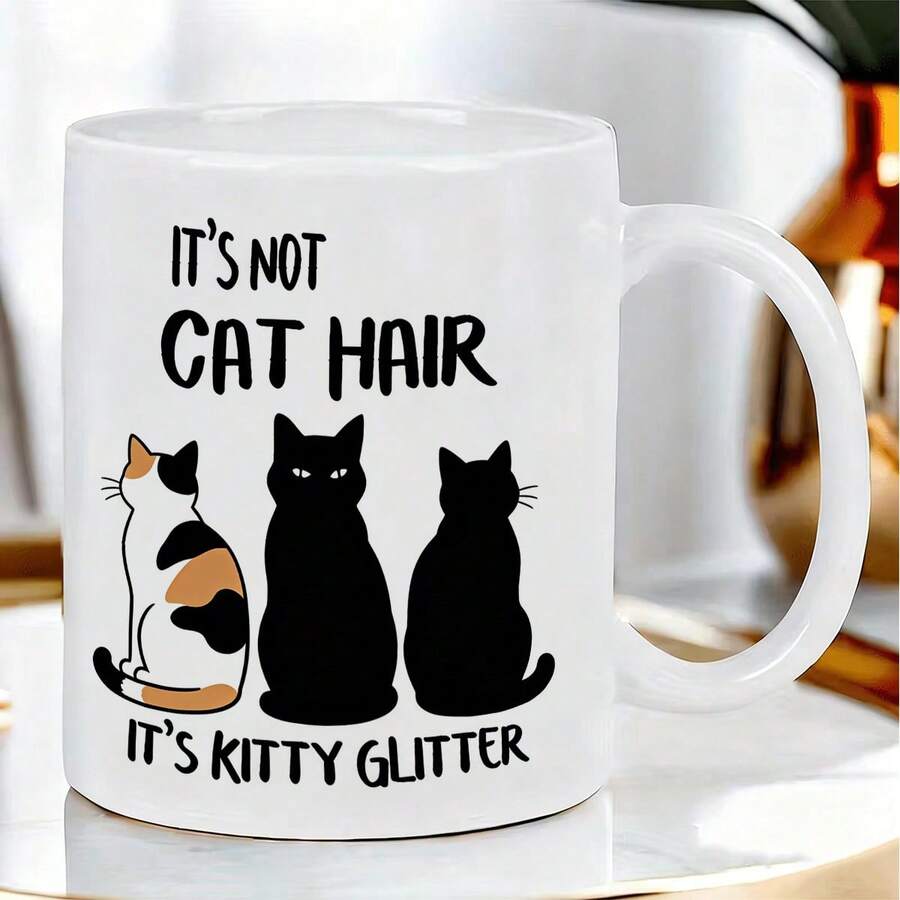 可爱有趣的猫咪剪影陶瓷马克杯，印有幽默的“这不是猫毛，这是猫咪闪粉”字样，造型自然逼真，双面清晰印刷，经久耐用，适合日常使用。 - 彩色 - 查看 1