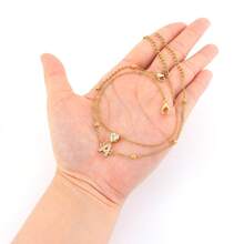 Set de 2 piezas Nuevo diseño de letra en forma de corazón de moda para mujer Tobillera, cadena de tobillo multicapa apilable de cuentas de acero inoxidable dorado - Amarillo Oro - Ver 3