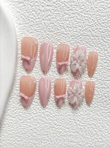 10件套甜美芭蕾风手工美甲套装，包含凝胶美甲套装、蝴蝶结装饰、小珍珠美甲饰品、手工五瓣花美甲贴、粉色指甲油，清新纯净风格，附赠美甲工具（1张果冻贴+1把指甲锉）。提供三种尺寸，适合杏仁形、鸭嘴形和棺材形指甲。适合派对、日常佩戴、聚会、拍照、春夏通勤等场合。 - 彩色 - 查看 12