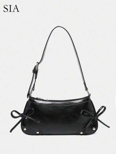 1个复古蝴蝶结装饰外露内衬黄色豹纹单肩/腋下法棍包，适合约会、外出、派对等场合。