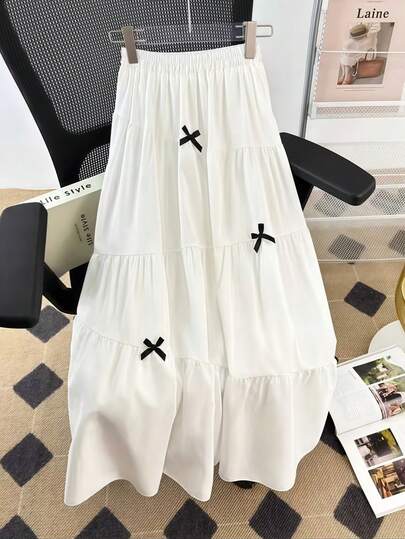 1 chiếc chân váy maxi xếp ly hai lớp màu trơn kiểu Pháp, có nơ trang trí, thích hợp cho đi biển, trang phục cuối tuần, chụp ảnh mùa hè, váy dự tiệc lễ Phục sinh, và phối cùng trang phục công sở.