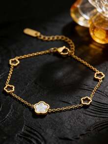 Vòng tay hình cỏ ba lá rỗng tối giản, điểm nhấn là một hạt xà cừ trắng duy nhất, tinh tế và thanh lịch, phụ kiện đa năng phù hợp cho cả ngày thường và các dịp đặc biệt. - Vòng tay khoét rỗng năm bông hoa - Xem 4