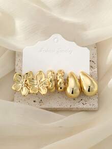 2/6/18件套金色优雅时尚耳环套装，包含：空心圆环、光滑大C、波浪C、五瓣花、小月亮、刻面宽C、大五瓣花、扭曲C、光滑水滴形。适合日常佩戴、旅行、度假、派对、约会等场合。送给妈妈的绝佳礼物。 - 金色 - 查看 8