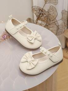 女婴/幼儿象牙色珍珠蝴蝶结公主鞋，软底防滑婴儿礼服鞋 - 米色 - 查看 2