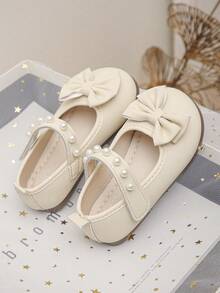 女婴/幼儿象牙色珍珠蝴蝶结公主鞋，软底防滑婴儿礼服鞋 - 米色 - 查看 5