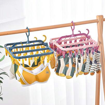 Giá phơi tất tiết kiệm không gian với móc chống gió và nhiều kẹp, giá phơi đồ bằng nhựa thời trang, phù hợp cho sinh viên và bà nội trợ, có thể gấp gọn và cất giữ, hoàn hảo cho ban công ký túc xá, có thể treo đồ lót và quần áo, vật dụng cần thiết để sắp xếp phòng giặt, phụ kiện ban công.