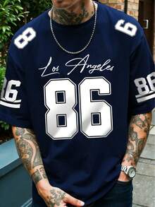 Áo thun nam in hình số 86 và chữ "Los Angeles" viết tay, rộng rãi và thoải mái, phù hợp cho các hoạt động thường ngày, thể thao, sinh viên. Chất liệu sợi polyester, nhanh khô và dễ giặt. - Màu xanh hải quân - Xem 2