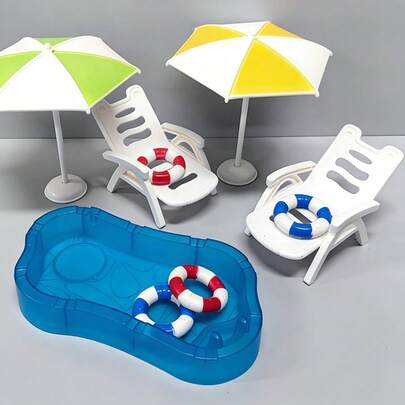 1 Bộ mô hình nhà búp bê thu nhỏ gồm bể bơi, phao bơi, cây dừa, dù che nắng, ghế bãi biển và các vật trang trí thu nhỏ.