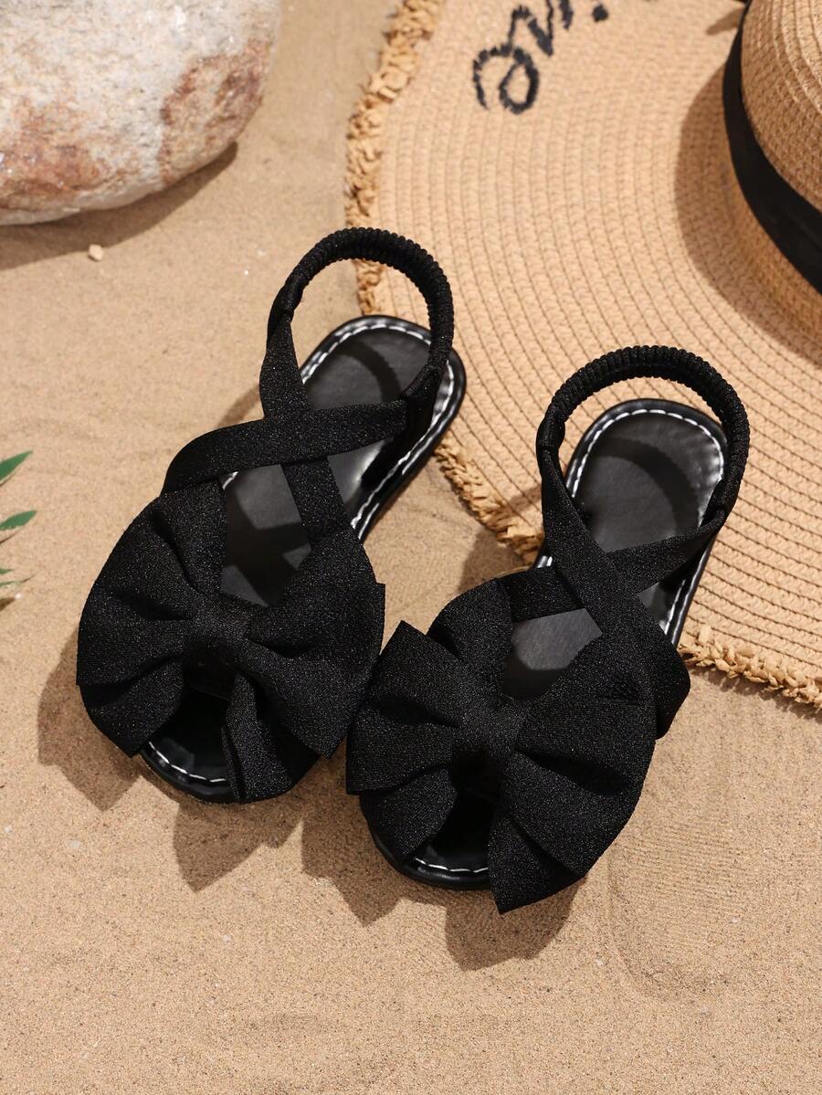1 Pair Girls' Flat Sandals, Solid Soft Fabric With Bow Decor, Round Toe Slip-On Soft Non-Slip Elastic Design, Fashionable Bohemian Cute Princess Style Beach Sandals, Suitable For Daily Casual, Campus, Holiday Wear, Spring/Summer New Arrival - Black - View 1