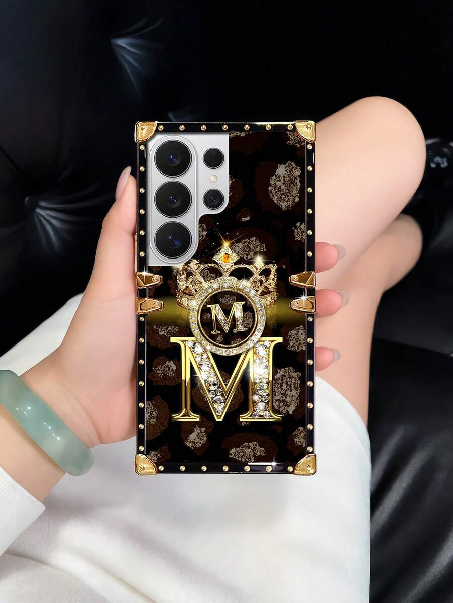 1pc Gold Letter With Crown Flat Pattern Rectangle Shockproof Phone Case, Comes With Matching Rhinestone Ring Holder Stand, Compatible With Samsung Galaxy S26 Ultra/S26/S26 Plus/S25FE/S25Ultra/S25+/S25/S24 Plus/S24/S24U/S23 Ultra/S22ULTRA/A56 5G/A36/A17/A16 And 17proamx/17/16 Promax/16/15PRO Max/15/14 Plus/15plus/14 Pro Max/13promax Models. [International Version, Not Domestic] - Black and Gold + Ring Holder - View 1