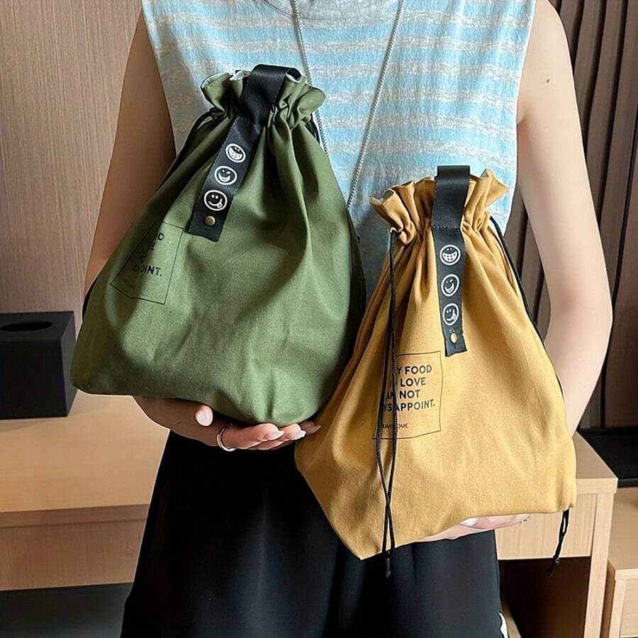 Túi đựng cơm trưa cách nhiệt có dây rút, giữ cho thực phẩm tươi ngon và giữ được độ giòn. Túi tote dã ngoại/ăn trưa bằng vải canvas kiểu công nghiệp tối giản với dây rút, lý tưởng cho các buổi dã ngoại và đi chơi với bạn bè.