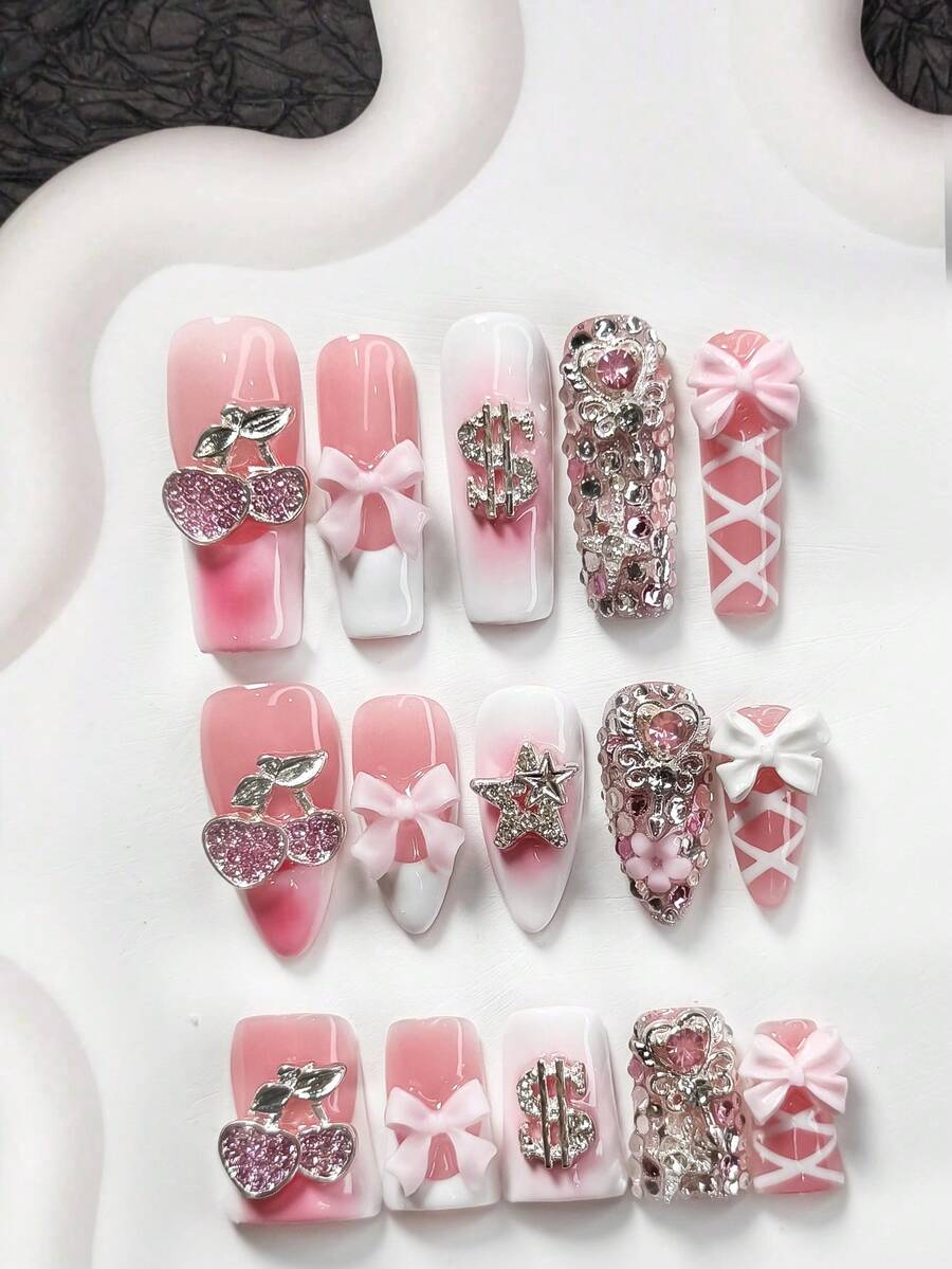 10件套甜美个性化美甲套装，包含凝胶指甲、樱桃、丝带蝴蝶结、镂空星星、魔法棒、水钻和美甲装饰品，白色和粉色指甲油，奢华风格，附赠美甲工具（1个果冻贴纸+1个指甲锉），提供3种尺寸，适合杏仁形、鸭嘴形、棺材形指甲，适用于派对、日常佩戴、约会、工作等场合。 - 彩色 - 查看 1
