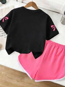 Set di maglietta a girocollo e pantaloncini con stampa a quadri, fiocchi e stelle per ragazze adolescenti, nuovo outfit estivo alla moda e confortevole - nero - Visualizzare 3