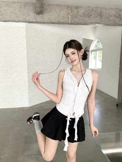 2026 女士夏季无袖V领露脐上衣，荷叶边下摆纯色修身性感不规则下摆背心