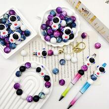 25颗宇航员硅胶珠套装，蓝红两色，太空飞船和宇宙图案，适用于珠宝制作、耳环、项链、包包、钢笔、手机链、化妆刷及其他DIY工艺品。 - 太空人系列 - 查看 10