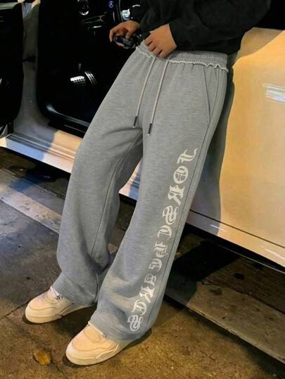 Men's Casual Athletic Trousers, Loose Straight Leg Design With A Good Drape, Suitable For Both Lounging At Home And Outdoor Activities. Makes A Great Gift For Couples. Made Of 100% Polyester, Features A Drawstring Waistband For Easy Adjustment. Available In Multiple Colors. Spring