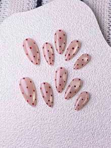 10片手工杏仁形粉色亮面猫眼红色波点情人节设计假指甲。采用手绘粉色亮面猫眼效果，并点缀红色波点。这款优雅浪漫的简约美甲贴片，尽显高端性感奢华。适合日常佩戴、约会、音乐会和轻度商务场合，是送给女士和女孩的绝佳礼物。 - 彩色 - 查看 3