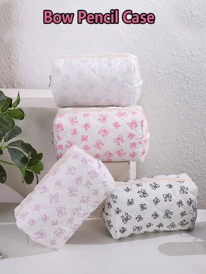 1 chiếc túi đựng văn phòng phẩm cỡ lớn, màu hồng kẻ sọc, có nơ, kiểu dáng thẩm mỹ, dễ mang theo, dùng để đựng đồ dùng học tập.