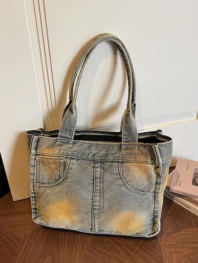 新款复古风做旧牛仔单肩手提包——独特设计，休闲百搭，容量充足，是购物和通勤的理想之选。