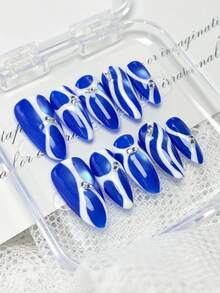 10片手工制作的杏仁形按压式美甲，春夏风格亚克力假指甲套装，饰有蓝色猫眼效果和不规则白色线条——闪亮奢华，非常适合女性和女孩日常佩戴。 - 彩色 - 查看 1