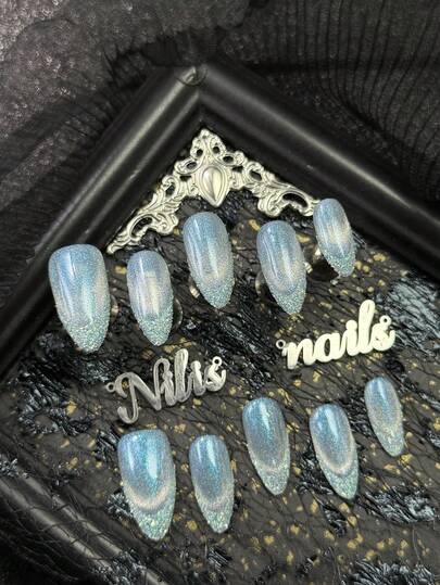10pcs Almonds Nail Acrylic Kit, Light Blue Nails, With A Light Blue Glitter Powder On The Tip And Silver Shimmering Cat Eyes, Giving A Refreshing And Transparent Visual Sensation, Y2K Style Nail Art Set,Suitable For Women And Girls,Festivals,Daily,Party,Gatherings And OtherPlaces Use(Includes: A Piece Of Jelly Glue And A Friction Strip) Nail Stuff