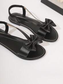 女士优雅简约甜美3D蝴蝶结T字带弹力后跟平底凉鞋，少女黑色露趾百搭夏季凉鞋 - 黑色 - 查看 6