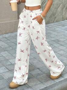 Quần ống rộng cạp cao màu trắng LOVE JOYY dành cho nữ, kiểu dáng thường ngày, ngọt ngào, in nơ đỏ, có dây rút, lưng thun, dáng suông, có túi, thích hợp cho các hoạt động thường ngày mùa hè, đi làm, hẹn hò, du lịch. - Nhiều màu - Xem 3