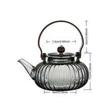 Ấm trà thủy tinh hình quả bí ngô kẻ sọc, làm bằng thủy tinh borosilicate, có tay cầm bằng gỗ óc chó và khung xách. Bộ lọc trà thủy tinh dung tích lớn. - Nhiều màu - Xem 8