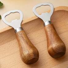 1 chiếc dụng cụ mở nắp chai bia bằng gỗ keo, tay cầm bằng gỗ nguyên khối, màu vàng hồng, dụng cụ mở rượu vang để bàn thiết kế độc đáo, dụng cụ mở nắp chai bằng thép không gỉ. - Xem 10