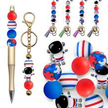 25颗宇航员硅胶珠套装，蓝红两色，太空飞船和宇宙图案，适用于珠宝制作、耳环、项链、包包、钢笔、手机链、化妆刷及其他DIY工艺品。 - 太空人系列 - 查看 7